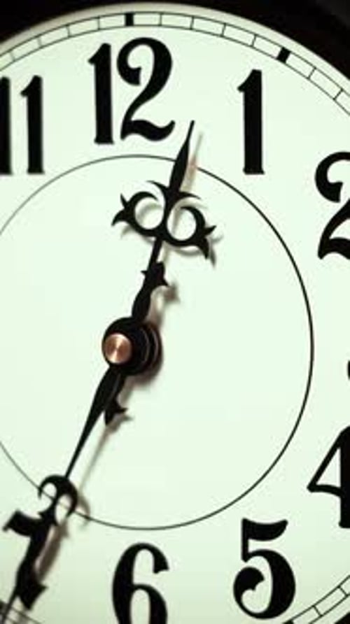 Vertical Ornate Black Hands Moving On White Clock