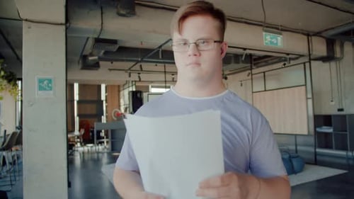 Collaborative Office Team Reviewing Documents Together