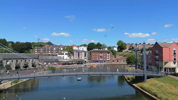 Exeter Quay on a summers day, flying over the River Exe Bridge while ...