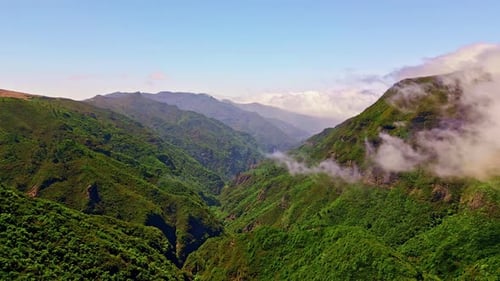 Aerial View Green Mountains with Low Clouds Sky Serene Greenery Peak Landscape