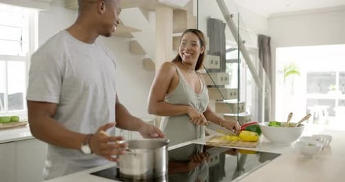 Couple Cooking Together in Bright Modern Kitchen