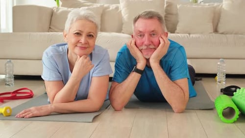 Senior Couple Relaxing After Home Workout