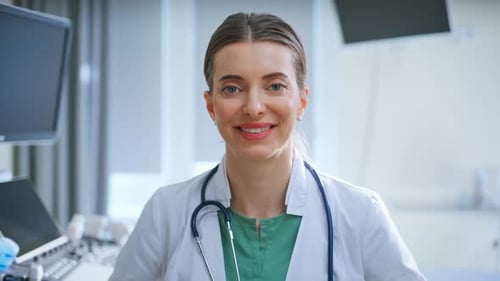 Portrait Smiling Doctor Posing with Stethoscope at Clinic Woman Looking Camera