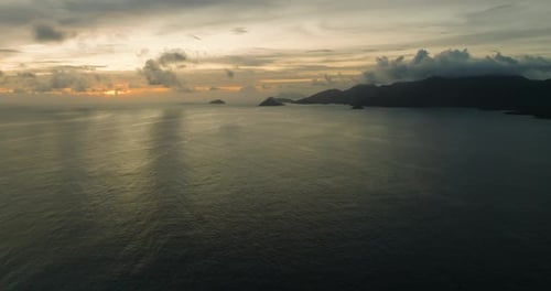 Sunset View Over Ocean with Distant Islands