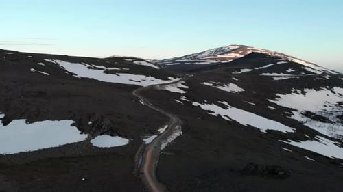 Snowy Mountain Pass From Above Peaceful Mountain Landscape With Snow Patches And Distant Peaks Media