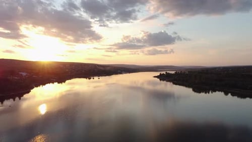 Aerial Drone Flight of Summer Sunset Reflecting on the Lake Water Scenic Footage of Nature