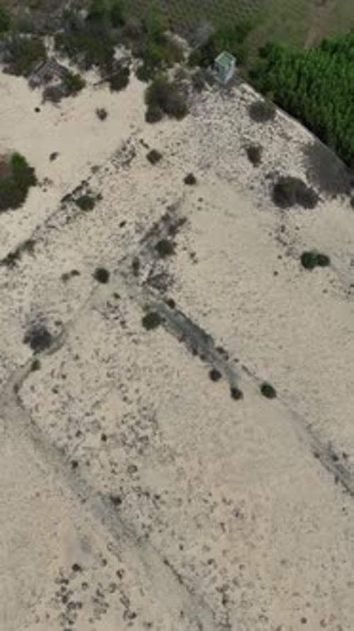 Aerial View Tilt of the land and the Mountain in La Gi (Vietnam).