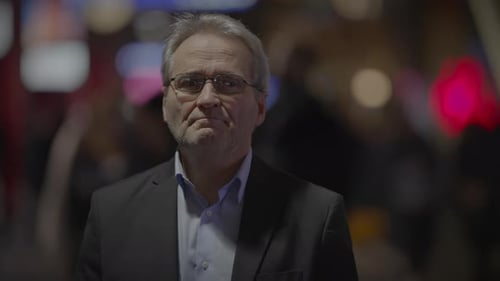 Senior Man Standing Out of Focus City Background