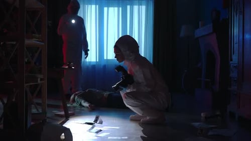 Forensic Investigators Examine Crime Scene at Night