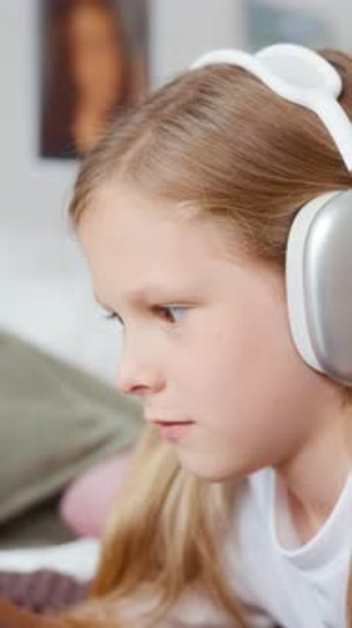 Side Closeup of Girl Drawing on Tablet with Stylus