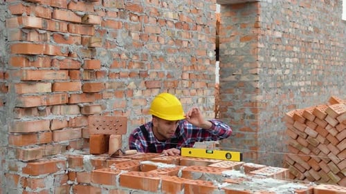 Worker Control Brick Wall Using Level Tool