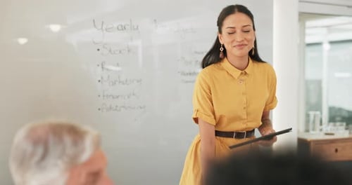 Woman giving presentation in office meeting