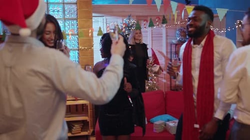 Friends Celebrate Christmas with Champagne and Dancing