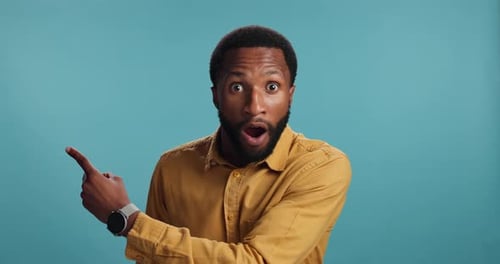 Surprise, pointing or face of man with space for breaking news, announcement or sales offer