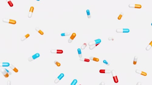 Red Blue Orange Capsules Slowly Fall Against White Backdrop Drugs Pills Tablets Medicine Concept 3d
