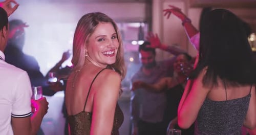 Friends Celebrating with Champagne in a Nightclub