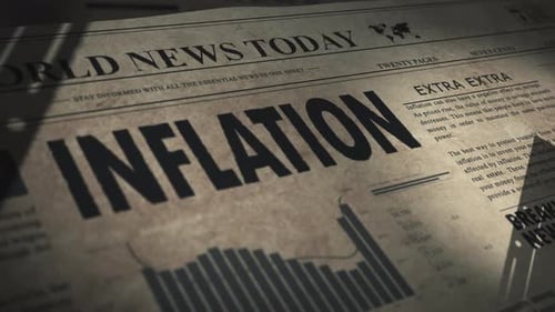 Inflation headline in daily newspaper with digital graphs and stock market prices