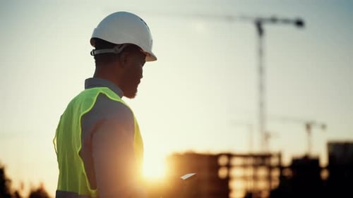 Engineer on Construction Site Black Man Using Smartphone Typing Message African American Male Person