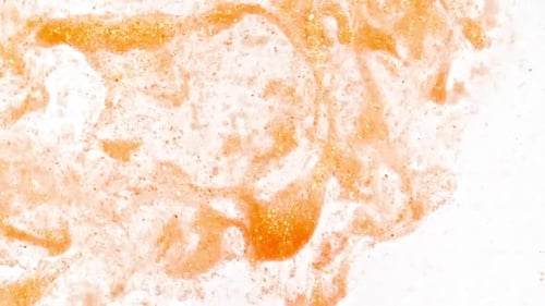 Abstract Swirling Orange Paint on White Background