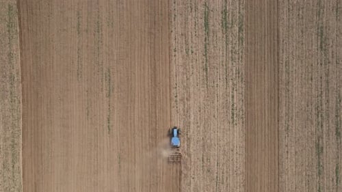 Agricultural Work with Tractor Preparing Field for Harvesting