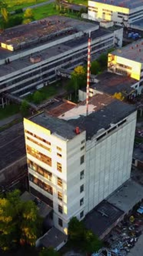 Old Industrial Factory Buildings. Vintage old big factory with closed door and broken windows