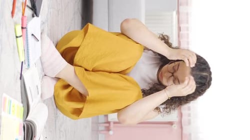 Woman Feeling Stressed While Studying at Home