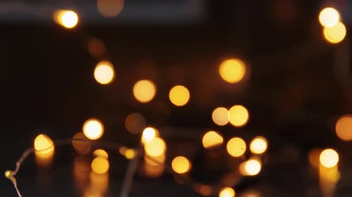 Defocused Warm Christmas Lights Garland Background for Festive Mood