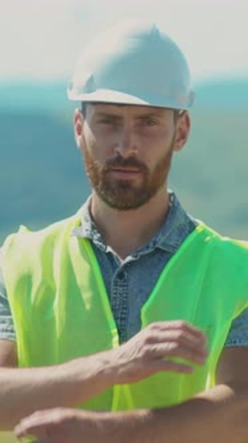 A Diligent Construction Worker Wearing Appropriate Safety Gear Engages at a Job Site