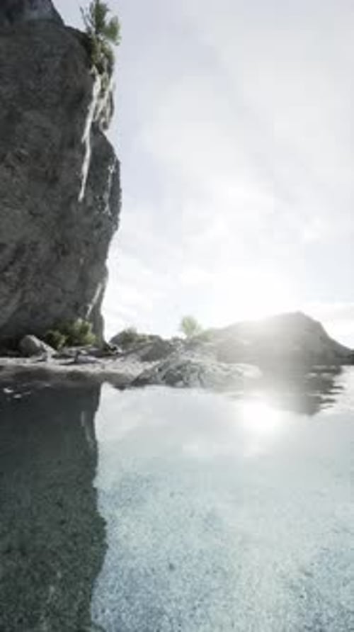 Sun Shines on Water By Rocks