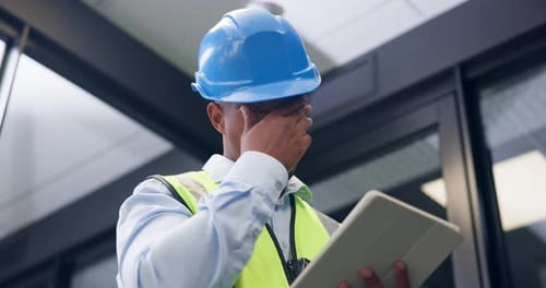 Black man, tablet and engineer in office with stress, notes or low angle for construction project