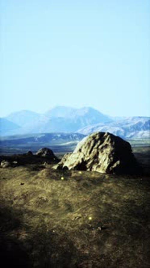 Large Rock on Grass Field