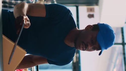 Delivery Person Gets Signature From Recipient Using Tablet