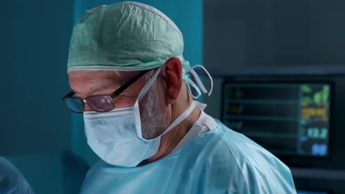 Team of Professional Medical Surgeons Performs the Surgical Operation in a Modern Hospital Doctors