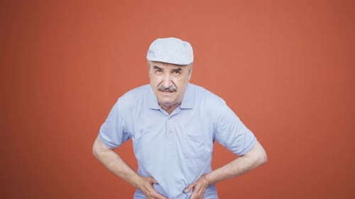 Old man experiencing stomachache.