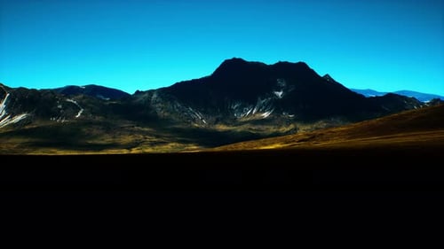 Majestic Mountain Landscape Under Clear Blue Sky During Daylight Hours