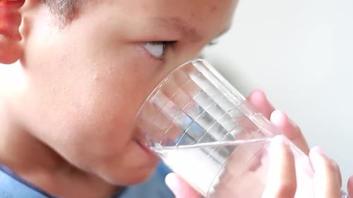Child Drinking Water Refreshment Close Up