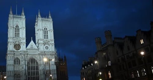 Evening view of traffic driving past of the Westminster Abbey, London, United Kingdom