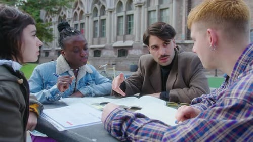 College Friends Studying Together Outdoors on Campus