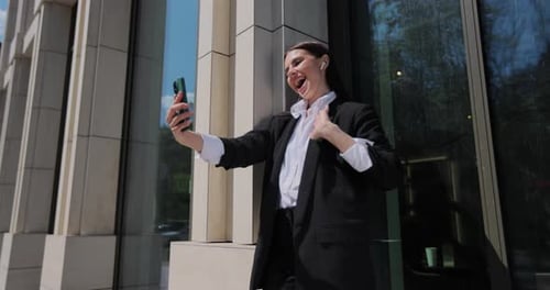 Woman in Business Suit Makes Video Call