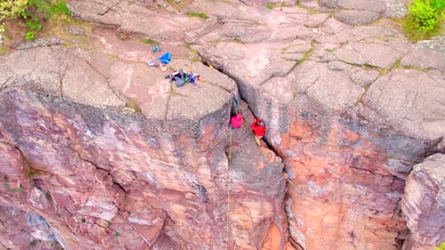 Rock Climbers on Steep Rocky Cliff, Aerial Drone
