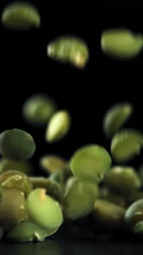 Green Peas Fall on the Table Filmed on a Highspeed Camera at 1000 Fps