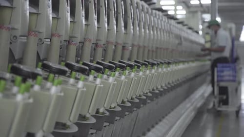 Industrial Machines Line in Bright Factory Interior