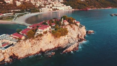 Aerial view of drone flying over island of the Sveti Stefan in Montenegro, Balkans nearby Adriatic