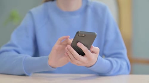 Woman Browsing Internet on Smartphone, Close up
