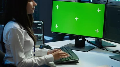 System Administrator Uses Replaceable Computer Monitor for Server Hub Work