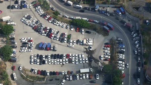 Top View of Cars Parking in Outdoor Parking Area in Bright Sunny Day