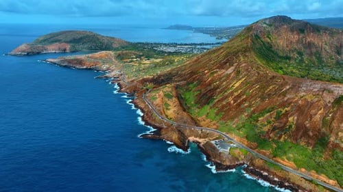 Highway along the Diamond Head Crater in the Hawaii, USA. Rocky coast of the Pacific Ocean.