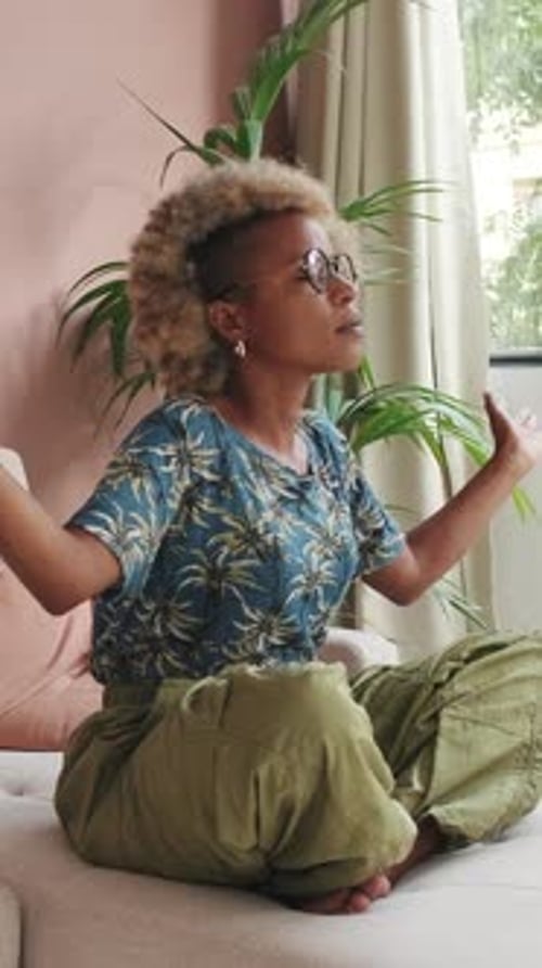 Woman Meditating Indoors in Peaceful Setting