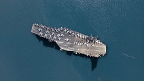 Naval carrier launching fighter jets in a strategic military operation
