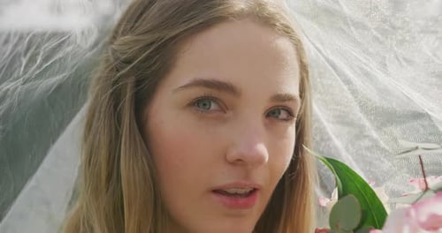 Smiling Bride with Flowers on Wedding Day
